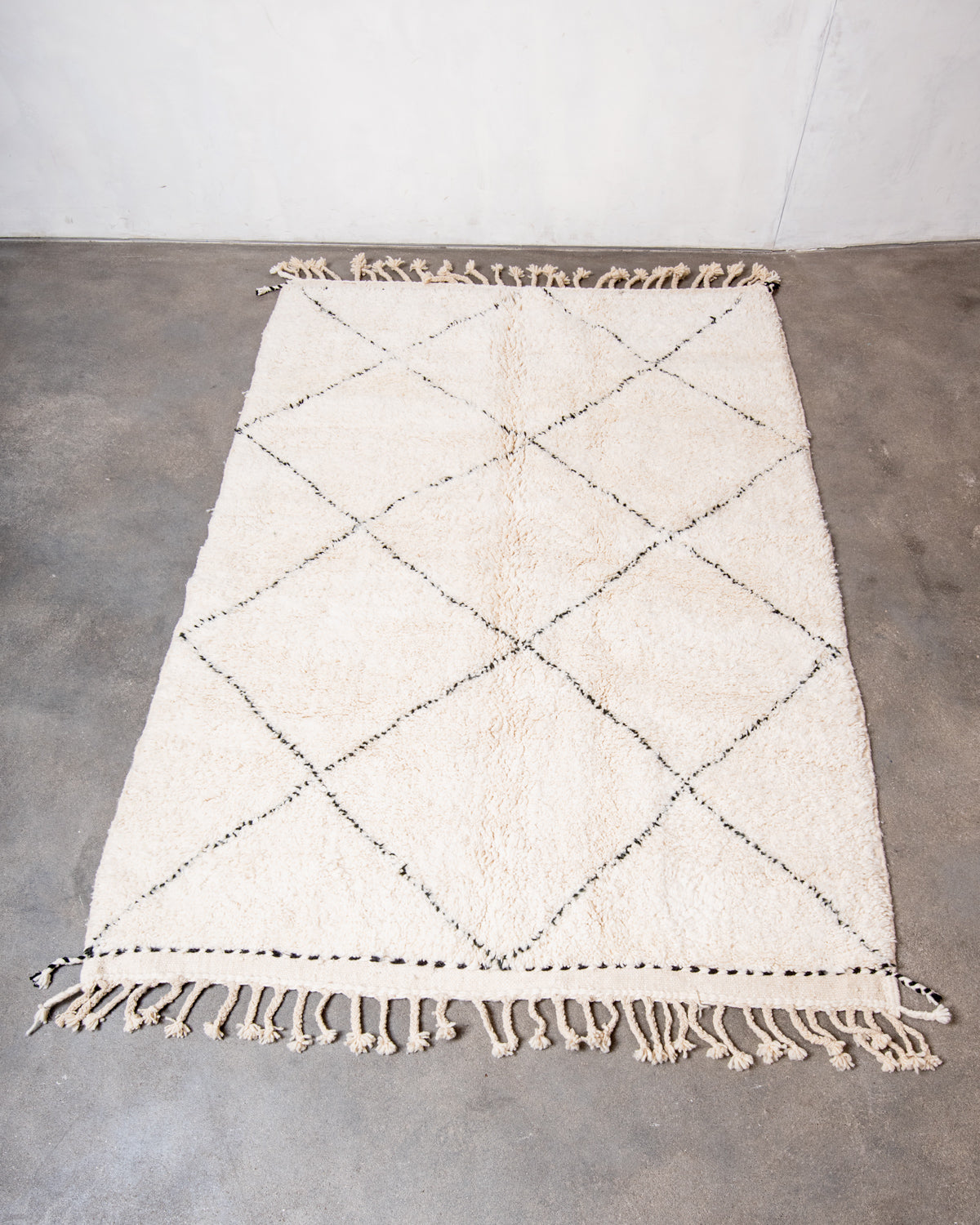 Modern, designer, handcrafted Berber rug from Morocco. Beniourain carpet with minimalist design, natural wool pile and a fluffy texture.